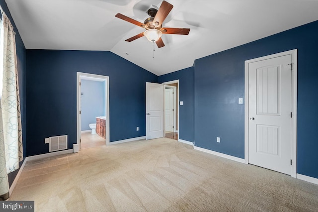 81 Toulouse Ln, Martinsburg, WV 25403 - unfurnished bedroom with carpet, vaulted ceiling, baseboards, ensuite bath, and a ceiling fan