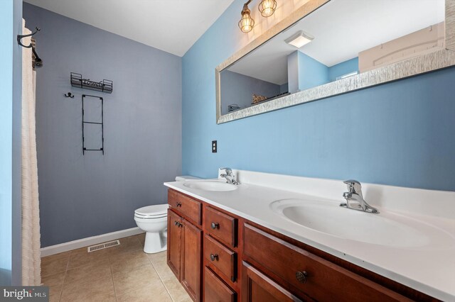 81 Toulouse Ln, Martinsburg, WV 25403 - full bath with double vanity, baseboards, toilet, and tile patterned floors