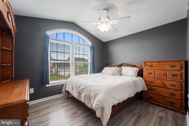 81 Toulouse Ln, Martinsburg, WV 25403 - bedroom featuring wood finished floors, lofted ceiling, baseboards, and a ceiling fan
