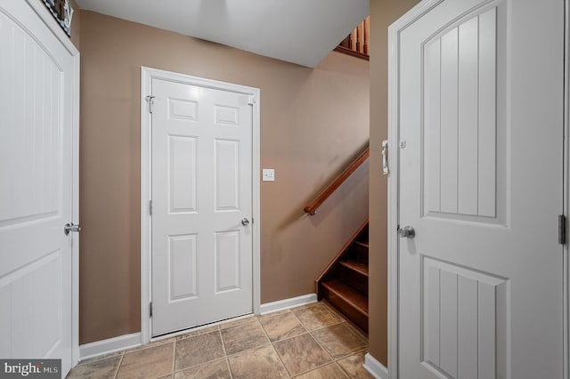 81 Toulouse Ln, Martinsburg, WV 25403 - entrance foyer featuring baseboards, stone finish floors, and stairway