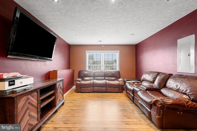 81 Toulouse Ln, Martinsburg, WV 25403 - living area featuring electric panel, light wood finished floors, and a textured ceiling