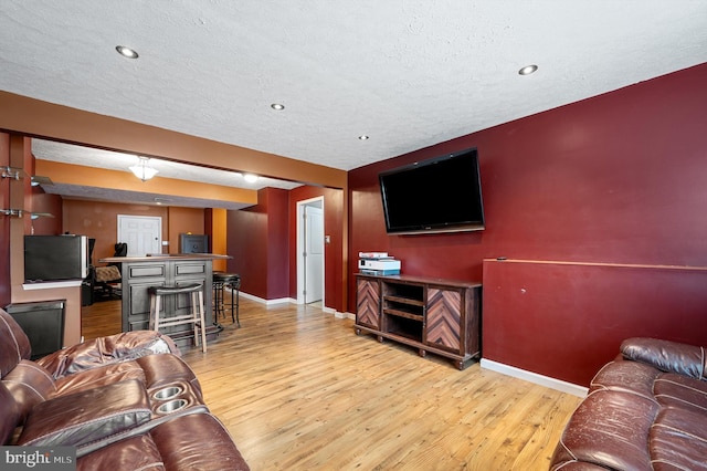 81 Toulouse Ln, Martinsburg, WV 25403 - living area with light wood-style flooring, baseboards, a textured ceiling, and recessed lighting