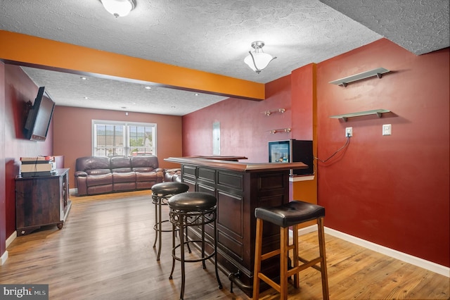81 Toulouse Ln, Martinsburg, WV 25403 - indoor dry bar featuring wood finished floors, baseboards, and a textured ceiling