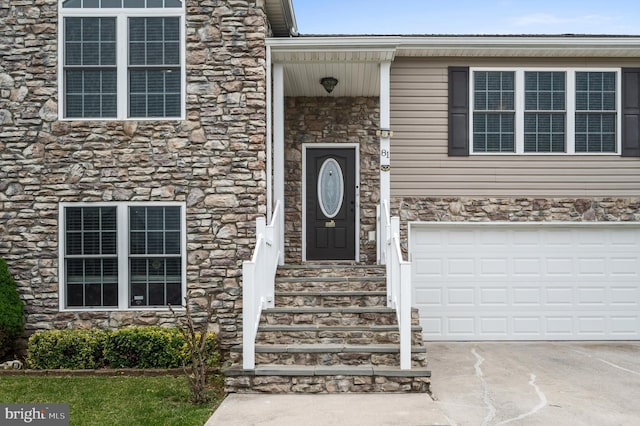 81 Toulouse Ln, Martinsburg, WV 25403 - entrance to property with stone siding, a garage, and driveway