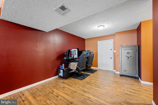 81 Toulouse Ln, Martinsburg, WV 25403 - home office with wood finished floors, baseboards, a textured ceiling, and vaulted ceiling