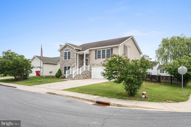81 Toulouse Ln, Martinsburg, WV 25403 - view of front facade featuring stone siding, driveway, and a garage