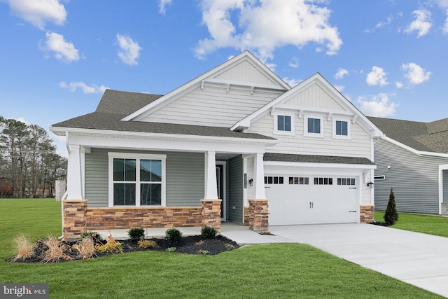 35243 Duck Haven Rd, Selbyville, DE 19975 - craftsman-style house with stone siding, concrete driveway, a porch, a front lawn, and an attached garage