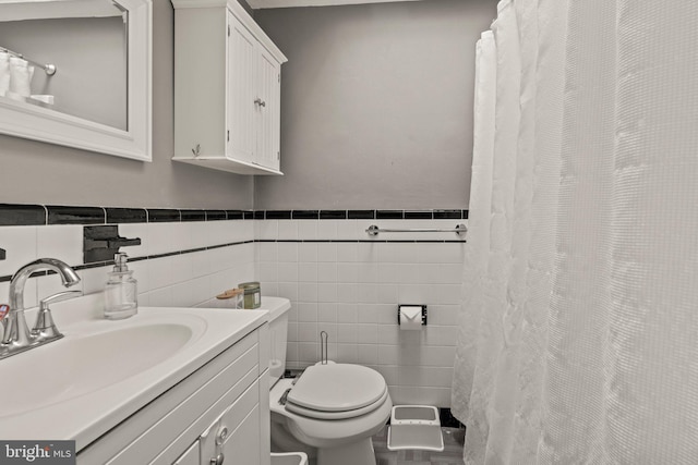 2319 Bond Ave, Drexel Hill, PA 19026 - full bathroom with tile walls, toilet, wainscoting, and vanity