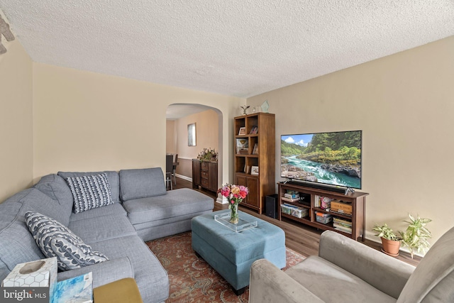 2319 Bond Ave, Drexel Hill, PA 19026 - living area featuring arched walkways, a textured ceiling, and wood finished floors