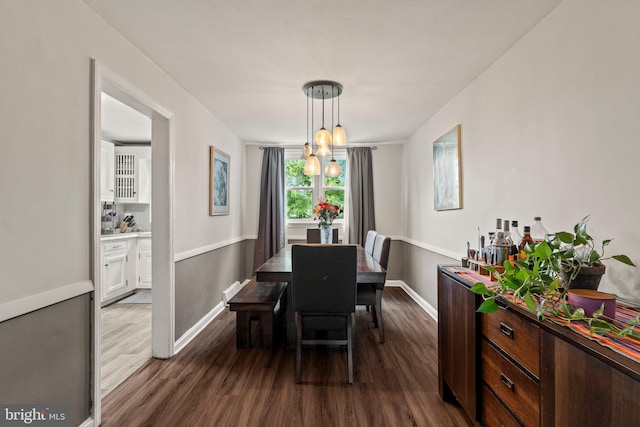 2319 Bond Ave, Drexel Hill, PA 19026 - dining area featuring dark wood-style flooring, baseboards, and a chandelier