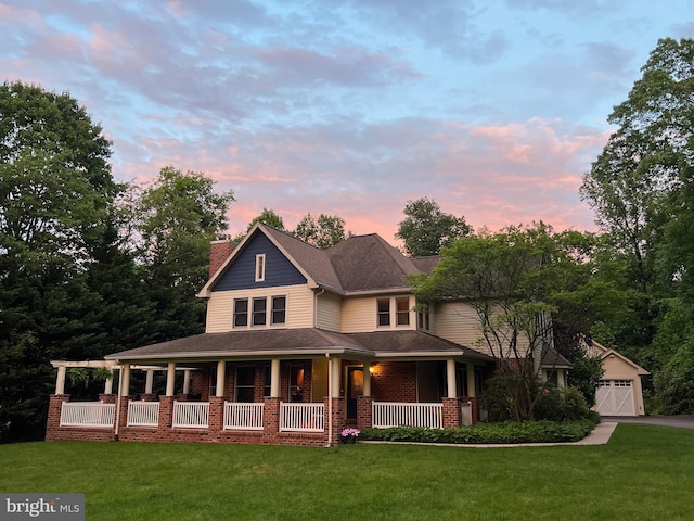 43 Shea Dr, Mohnton, PA 19540 - view of front of home with covered porch, a chimney, a front lawn, a garage, and brick siding
