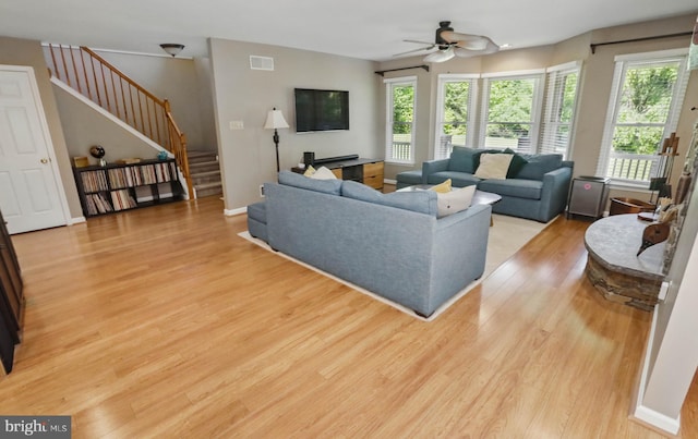 43 Shea Dr, Mohnton, PA 19540 - living area featuring stairway, light wood-style floors, and ceiling fan