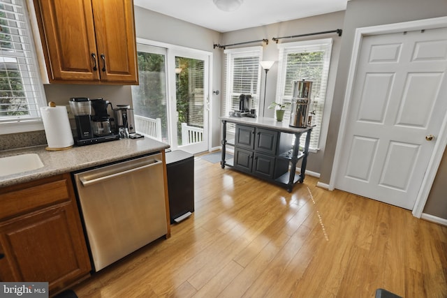 43 Shea Dr, Mohnton, PA 19540 - kitchen featuring dishwasher, brown cabinetry, light wood-type flooring, and baseboards