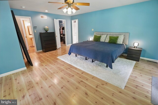 43 Shea Dr, Mohnton, PA 19540 - bedroom featuring wood finished floors, a walk in closet, baseboards, a closet, and recessed lighting
