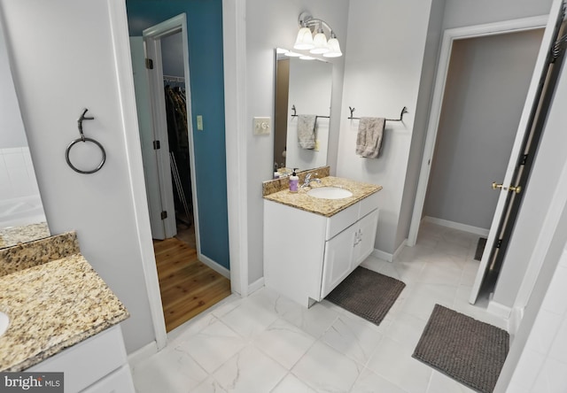 43 Shea Dr, Mohnton, PA 19540 - full bath with two vanities, a spacious closet, baseboards, and marble look tile flooring