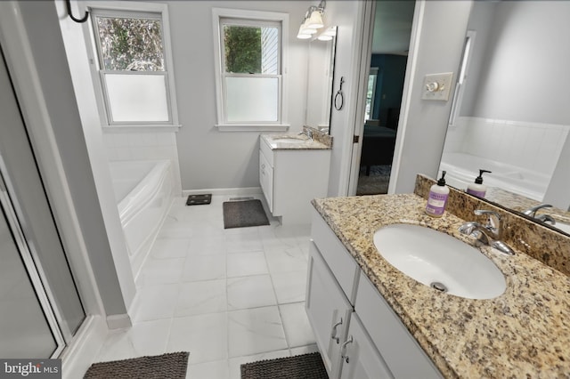43 Shea Dr, Mohnton, PA 19540 - full bathroom featuring vanity, a garden tub, baseboards, tile patterned floors, and a stall shower