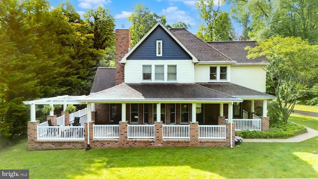 43 Shea Dr, Mohnton, PA 19540 - view of front of house with covered porch, a front lawn, roof with shingles, and brick siding