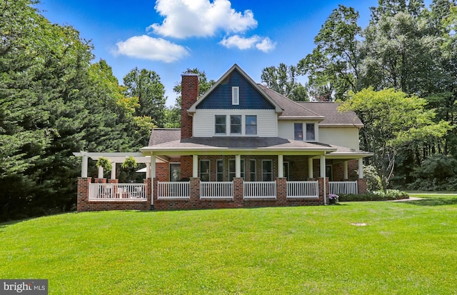 43 Shea Dr, Mohnton, PA 19540 - rear view of property with a porch, a yard, brick siding, and a chimney