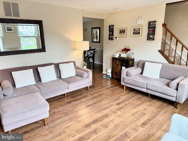 12415 Morning Light Ter, Gaithersburg, MD 20878 - living area featuring wood finished floors and stairs