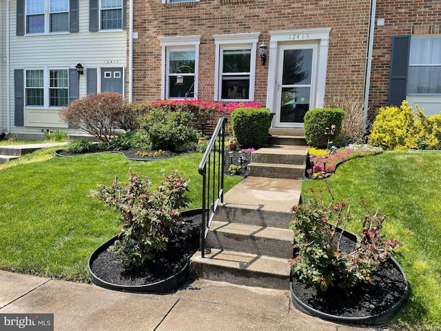 12415 Morning Light Ter, Gaithersburg, MD 20878 - property entrance with brick siding and a yard