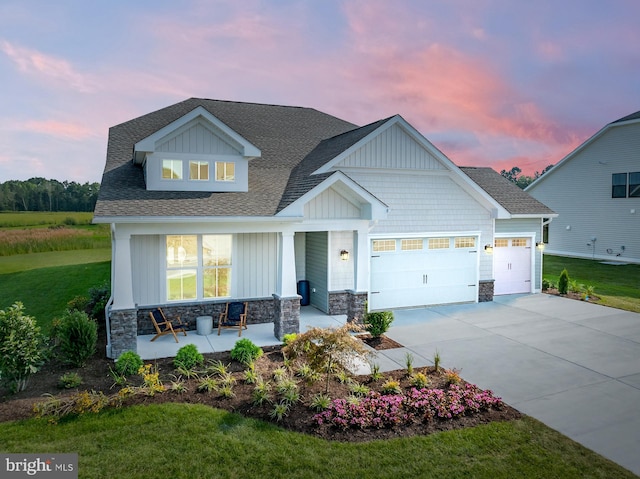 35212 Wild Goose Lndg, Selbyville, DE 19975 - craftsman inspired home featuring a porch, stone siding, an attached garage, a shingled roof, and concrete driveway