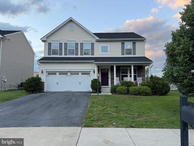 108 Buccaneer Ct, Stephenson, VA 22656 - view of front of home featuring covered porch, asphalt driveway, an attached garage, and a front yard