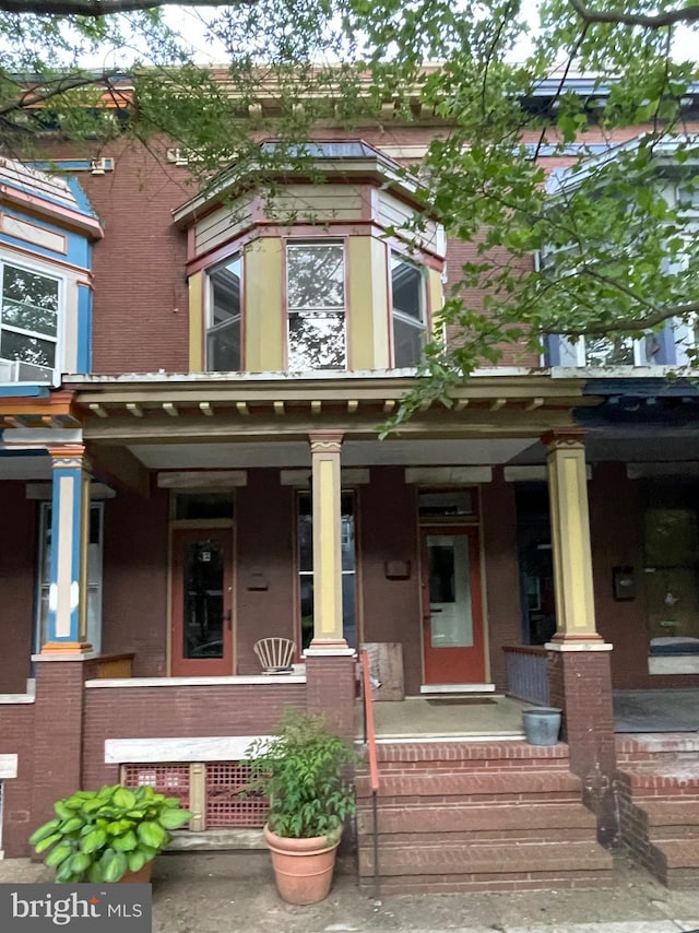 2732 Maryland Ave, Baltimore, MD 21218 - view of front facade with a porch and brick siding