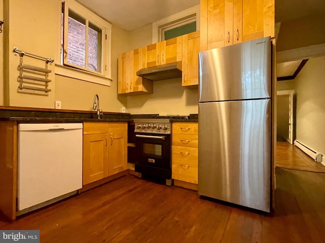 2732 Maryland Ave, Baltimore, MD 21218 - kitchen with stainless steel appliances, under cabinet range hood, dark wood-style floors, and a baseboard heating unit