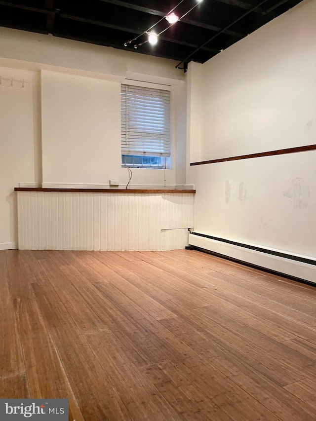 2732 Maryland Ave, Baltimore, MD 21218 - spare room featuring wood finished floors and track lighting