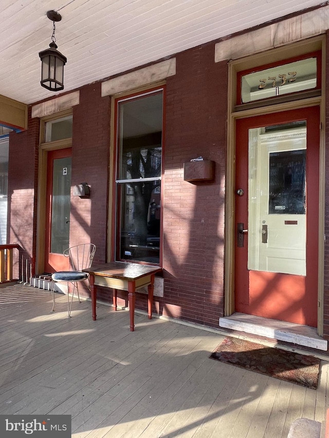 2732 Maryland Ave, Baltimore, MD 21218 - view of exterior entry with brick siding and a porch