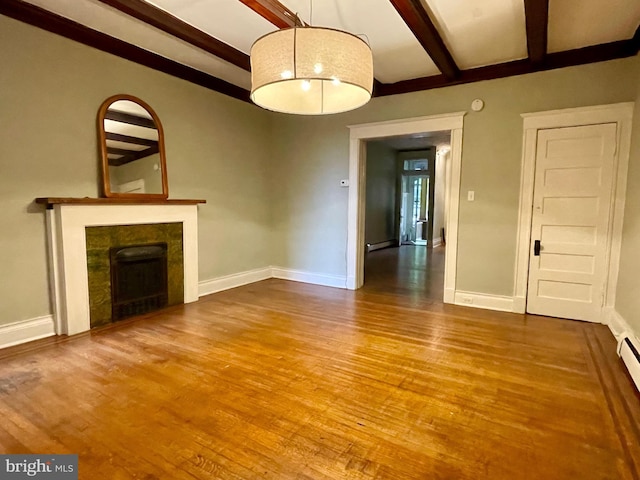 2732 Maryland Ave, Baltimore, MD 21218 - unfurnished living room with beam ceiling, wood finished floors, a tile fireplace, baseboards, and a baseboard heating unit