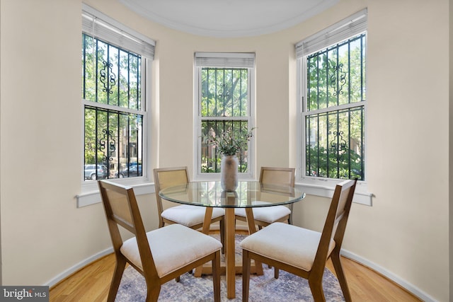 1742 U St NW Unit 101, Washington, DC 20009 - dining room with light wood-style floors and baseboards