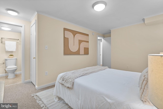 1742 U St NW Unit 101, Washington, DC 20009 - bedroom featuring crown molding, baseboards, ensuite bath, and light colored carpet