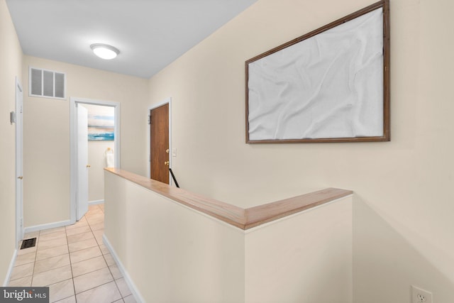 1742 U St NW Unit 101, Washington, DC 20009 - hall featuring an upstairs landing, light tile patterned floors, and baseboards