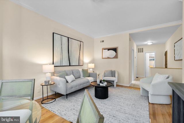 1742 U St NW Unit 101, Washington, DC 20009 - living room featuring wood finished floors, baseboards, and ornamental molding