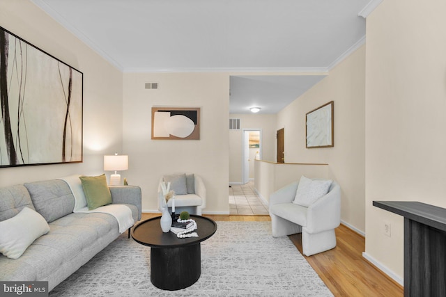 1742 U St NW Unit 101, Washington, DC 20009 - living room featuring wood finished floors, crown molding, and baseboards