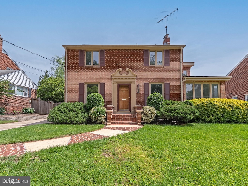 11 S Hudson St, Arlington, VA 22204 - colonial-style house with brick siding and a chimney