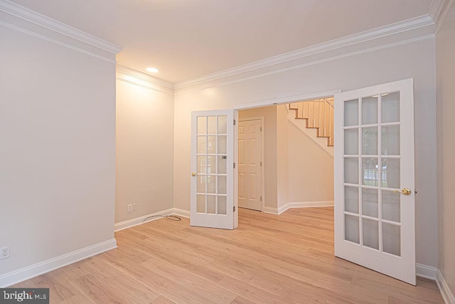 101 Port Arthur Ct, Ocean Pines, MD 21811 - empty room featuring french doors, crown molding, baseboards, light wood-style floors, and stairway
