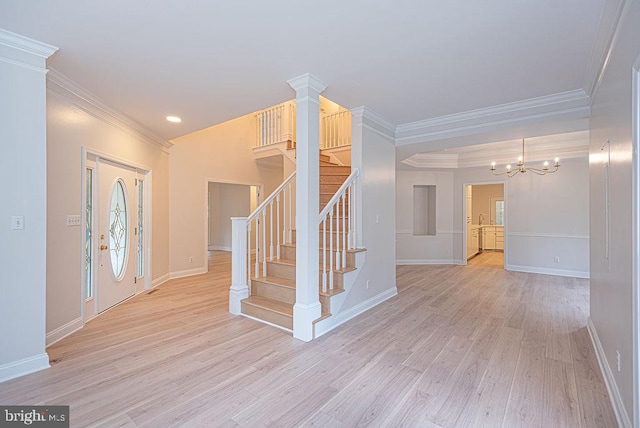 101 Port Arthur Ct, Ocean Pines, MD 21811 - entryway featuring light wood-style flooring, crown molding, stairs, a chandelier, and baseboards