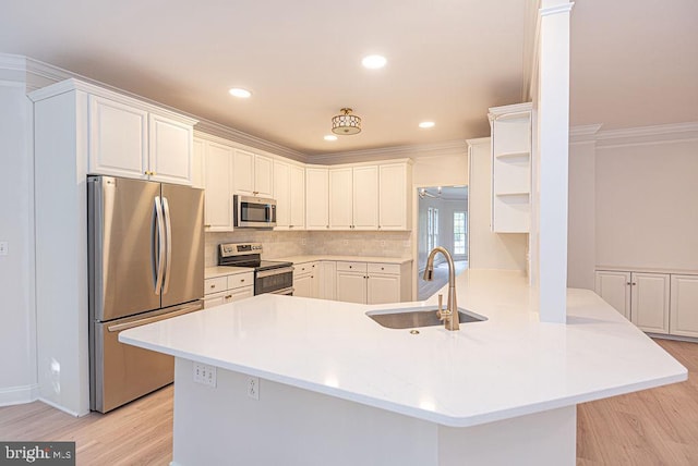 101 Port Arthur Ct, Ocean Pines, MD 21811 - kitchen featuring stainless steel appliances, a sink, open shelves, light wood-style floors, and recessed lighting