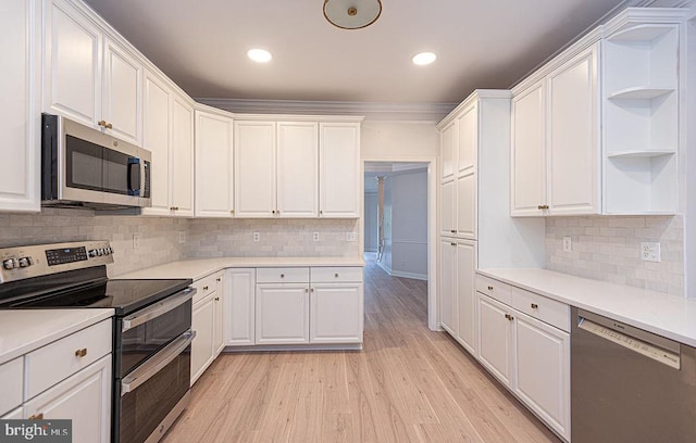 101 Port Arthur Ct, Ocean Pines, MD 21811 - kitchen with appliances with stainless steel finishes, open shelves, white cabinetry, light wood finished floors, and light countertops