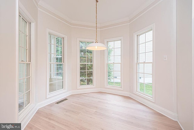 101 Port Arthur Ct, Ocean Pines, MD 21811 - unfurnished dining area featuring light wood-style floors, crown molding, plenty of natural light, and baseboards