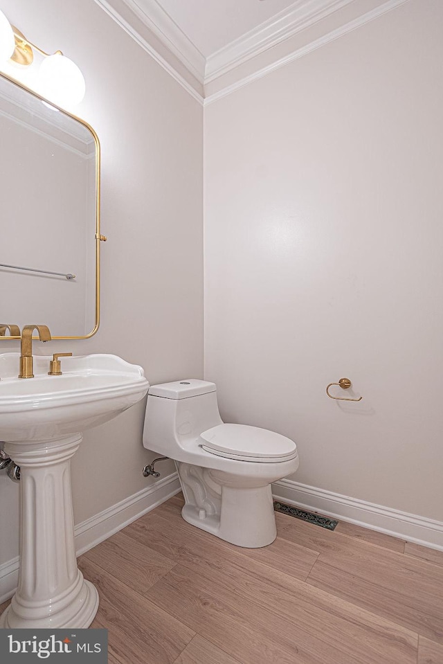 101 Port Arthur Ct, Ocean Pines, MD 21811 - bathroom with ornamental molding, baseboards, toilet, and wood finished floors