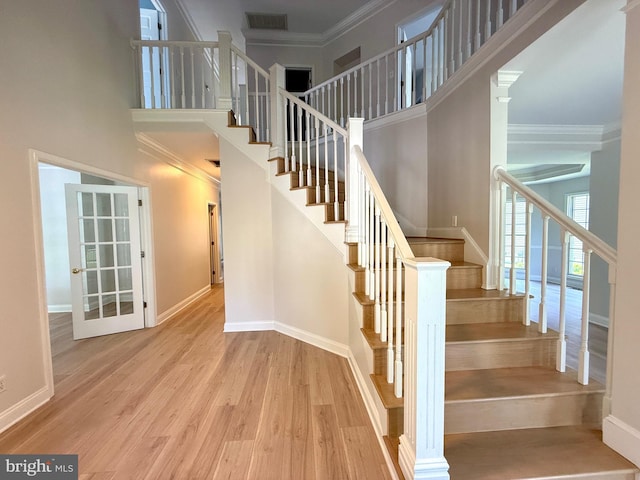 101 Port Arthur Ct, Ocean Pines, MD 21811 - stairway featuring a towering ceiling, wood finished floors, crown molding, and baseboards