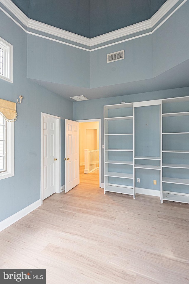101 Port Arthur Ct, Ocean Pines, MD 21811 - unfurnished bedroom featuring a high ceiling, wood finished floors, baseboards, and ornamental molding