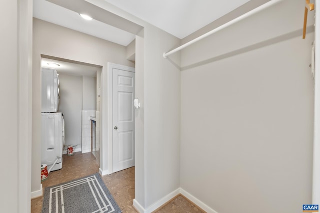 500 Court Sq Unit 503And 504, Charlottesville, VA 22902 - laundry room featuring stacked washer and clothes dryer and baseboards