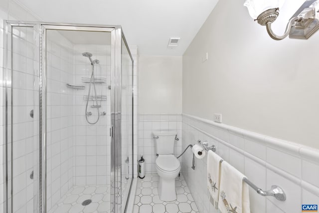 500 Court Sq Unit 503And 504, Charlottesville, VA 22902 - full bath with a stall shower, toilet, wainscoting, and tile patterned flooring