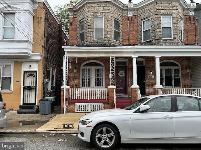 1204 Carl Miller Blvd, Camden, NJ 08104 - townhome / multi-family property featuring covered porch and brick siding