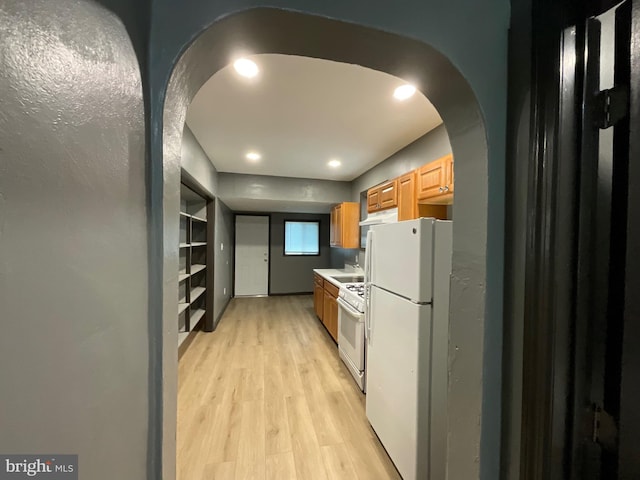 1204 Carl Miller Blvd, Camden, NJ 08104 - kitchen with white appliances, arched walkways, light wood-style floors, a sink, and recessed lighting