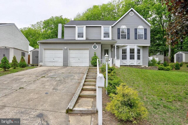 traditional home with a storage unit, driveway, a front lawn, an outdoor structure, and an attached garage